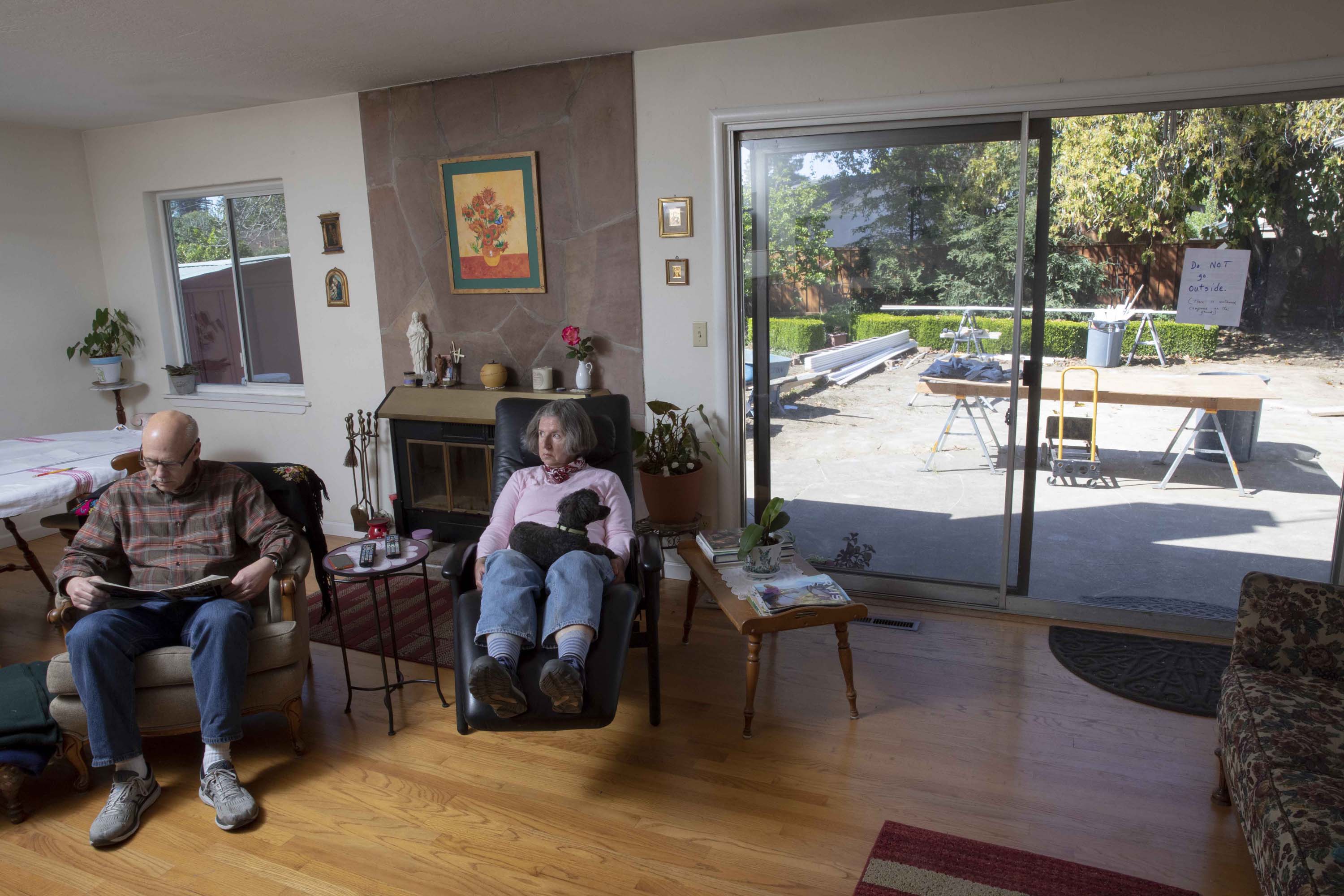 Paul and Rosa Boehm relax with their dog, Osa, in their San Jose home. A 538-square-foot Accessory Dwelling Unit is being added to their home's large backyard.