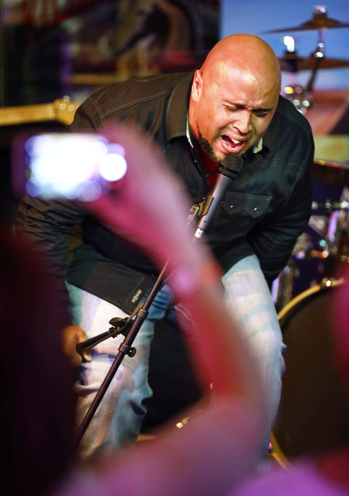 Kris Jones made his first appearance with a band in late September at a benefit show for teachers at J. Gilligan’s Bar & Grill in Arlington. He performed a set of 14 songs, a mix of his own original music and covers, as fans and family looked on. 